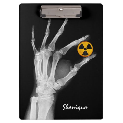 Hand Holding a Radiation Symbol  Clipboard