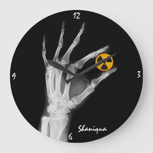 Hand Holding a Radiation Symbol    Large Clock