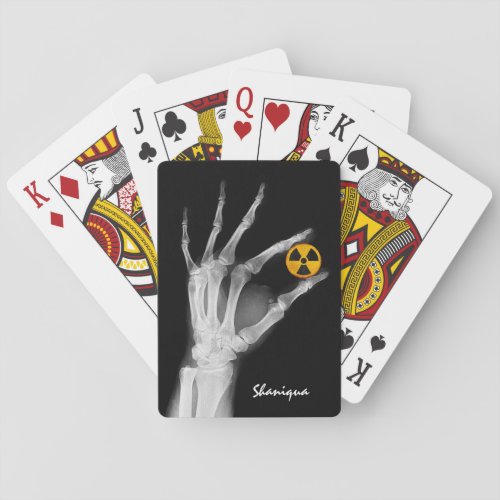 Hand Holding a Radiation Symbol  Playing Cards