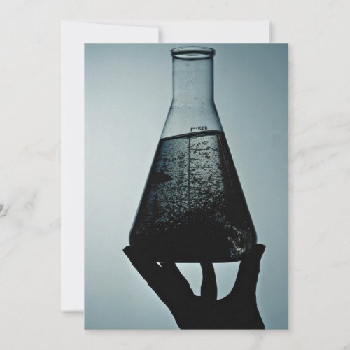 Hand holding an attractive laboratory beaker custom invites