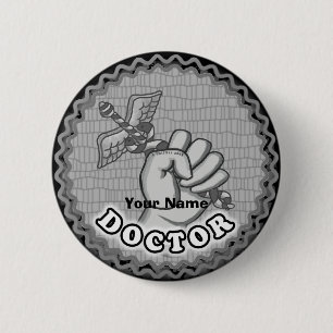 Hand holding caduceus doctor button