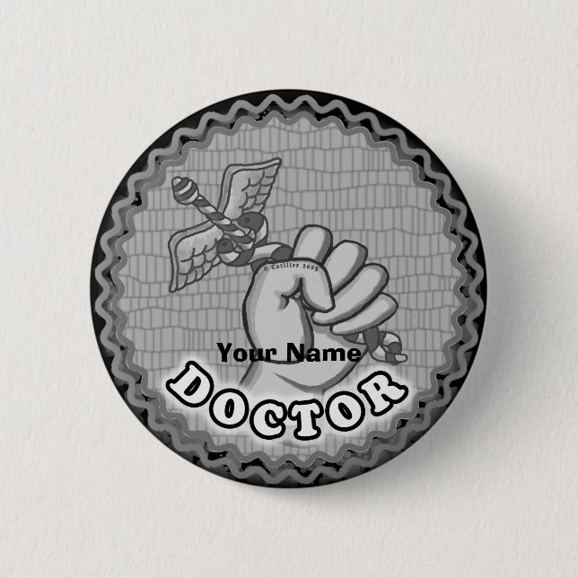 Hand holding caduceus doctor  button (Front)