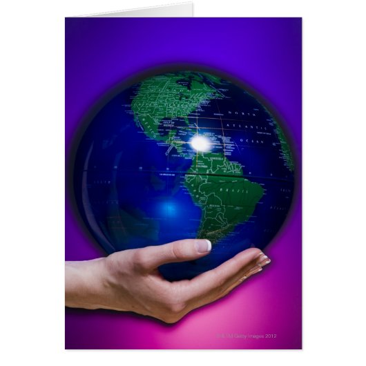 Hand holding earth cards (Front)