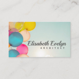 Hand holding multi colored balloons business card