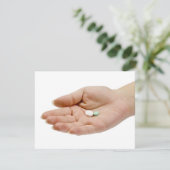 Hand holding pills (Standing Front)
