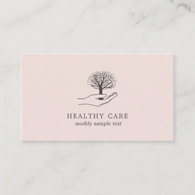 Hand holds tree business card (Front)