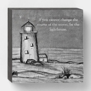 Hand sketched lighthouse with rocks peaceful scene wooden box sign