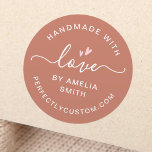 Handmade with love heart name URL terracotta brown Classic Round Sticker<br><div class="desc">Round stickers with light pink hearts, the text "handmade with love" and your custom name and website URL or other custom text on a terracotta brown background. The word "love" is written in an elegant calligraphy script font. Use as envelope seals, stickers for gifts and favours, product packaging etc. Follow...</div>