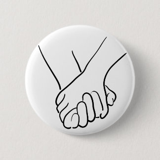 hands holding pinback button