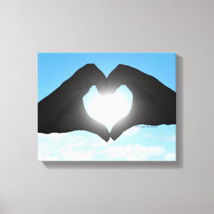 Hands in Heart Shape Silhouette on Blue Sky Canvas Print