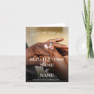 Hands of a colored wedding couple pin on ring announcement