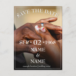 Hands of a colored wedding couple pin on ring announcement postcard