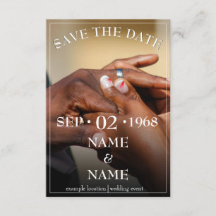 Hands of a colored wedding couple pin on ring enclosure card