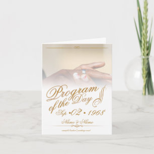 Hands of a colored wedding couple pin on ring gold card