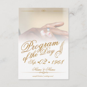 Hands of a colored wedding couple pin on ring gold enclosure card
