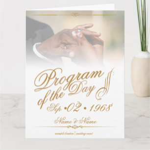 Hands of a colored wedding couple pin on ring gold thank you card