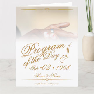 Hands of a colored wedding couple pin on ring gold thank you card