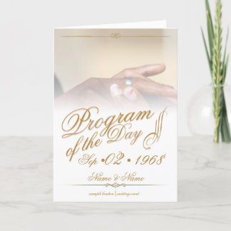 Hands of a colored wedding couple pin on ring gold thank you card