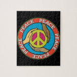 Hands of Peace Jigsaw Puzzle<br><div class="desc">Hands from people of different races help hold a peace symbol with the word peace around them.</div>