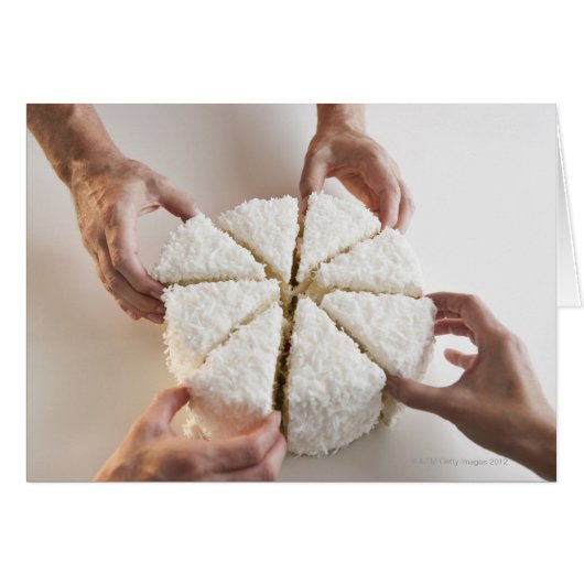 Hands pulling slices from cake cards (Front Horizontal)