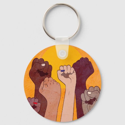 Hands with fist raised up over yellow sun  keychain