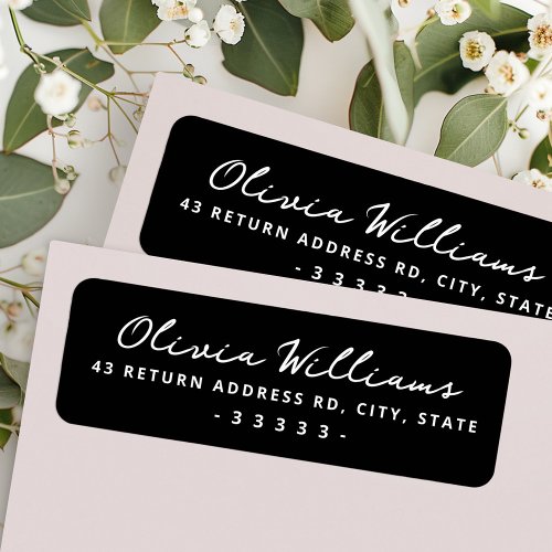 Handwritten script black return address label