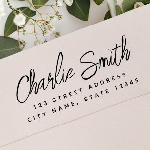 Handwritten script name return address rubber stamp