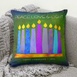 Hanukkah Bold Blue Candles Green Peace Love Light Throw Pillow<br><div class="desc">“Peace, love & light.” A playful, modern, artsy illustration of boho pattern candles in a menorah helps you usher in the holiday of Hanukkah. Assorted blue candles with colorful faux foil patterns overlay a rich, deep green textured background. Faux copper pattern foil on a rich dark green background for the...</div>