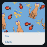 Hanukkah Cat Dreidel Blue Gift Tag Sticker<br><div class="desc">Cat lovers will be delighted with this fun whimsical "Hanukkat" pattern gift tag sticker, featuring an orange brown curious tabby cat wearing a kippah, red dreidels and yellow menorahs/channukiahs on a bright blue background. Perfect for wrapping your Hannukah / Chanukah gifts during the Jewish Festival of Lights! Personalize the text...</div>