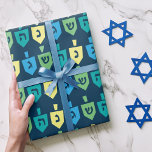 Hanukkah Dreidel Party Wrapping Paper<br><div class="desc">Share the joy of the holiday season with your friends and family with this Hanukkah Dreidel Party Wrapping Paper. This design features colorful dreidels on a navy background surrounded by confetti. Pair with other items from the Hanukkah Dreidel Party collection for a cohesive,  festive celebration.</div>