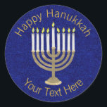 Hanukkah Gold Menorah On Rich Blue Background Classic Round Sticker<br><div class="desc">A classic Hanukiah design in gold and white on a deep blue faux sparkle background features space for your personalized text making this round sticker a unique addition to your Hanukkah celebrations. Use these Hanukkah stickers on mailings, scatter on a gift package or tuck them into favor bags as party...</div>