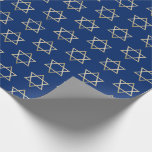 Hanukkah Gold Star of David on Blue Pattern Wrapping Paper<br><div class="desc">Wrap your gifts in style this holiday season with our elegant Hanukkah wrapping paper. This simple but chic design features a blue background with faux gold Star of Davids repeated into a pattern. Designed by artist © Susan Coffey.</div>