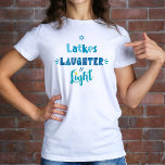 Hanukkah Latkes Laughter Light Modern Typography T-Shirt<br><div class="desc">“Latkes, laughter & light.” Be a trendsetter as well as get into the holiday spirit with this entertaining t-shirt! Fun, whimsical handcrafted typography in dusty blue, turquoise and teal on a white background, will delightfully help you get into the Hanukkah spirit. Matching cards, stickers, pillows, wrapping paper, serving trays, home...</div>