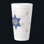 Hanukkah Latte Mug<br><div class="desc">Hanukkah Latte Mug The eight-day Jewish celebration known as Hanukkah or Chanukah commemorates the rededication during the second century B.C. of the Second Temple in Jerusalem, where according to legend Jews had risen up against their Greek-Syrian oppressors in the Maccabean Revolt. Hanukkah, which means “dedication” in Hebrew, begins on the...</div>
