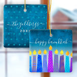 Hanukkah Menorah Candles Turquoise Keepsake Custom Ceramic Ornament<br><div class="desc">“Happy Hanukkah.” A playful, modern, artsy illustration of boho pattern candles helps you usher in the holiday of Hanukkah in style. Assorted blue candles with colorful faux foil patterns overlay a turquoise gradient to white textured background. On the back, personalize with your family name and year, over a tiny turquoise...</div>