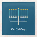 Hanukkah Menorah in Blue Custom Family Name Glass Coaster<br><div class="desc">Celebrate the Festival of Lights with this elegant glass coaster,  featuring a minimalist menorah design on a deep blue background. Perfect for Hanukkah gatherings or as a thoughtful gift,  this coaster can be personalized with your family name,  adding a special touch to your holiday decor.</div>