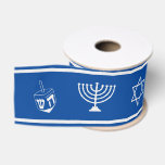 Hanukkah Ribbon | Menorah, Star of David, Dreidel<br><div class="desc">Festive blue and pale silver Hanukkah ribbon featuring a  dreidel,  menorah,  and Star of David in a repeat pattern,  edged in pale silver on a blue background. Shown is a 3" grosgrain ribbon. Other material and width available. Designed by WebzPickz.</div>