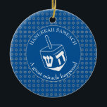 HANUKKAH SAMEACH | Dreidel | Chanukah Ceramic Ornament<br><div class="desc">Stylish HANUKKAH SAMEACH Ornament with faux silver Star of David in a tiled pattern and a large white dreidel at the centre. The background color is Tekhelet Blue. The text reads HANUKKAH SAMEACH at the top and A GREAT MIRACLE HAPPENED at the bottom. Both are CUSTOMIZABLE if you wish to...</div>