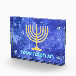 Hanukkah Snowstorm Menorah Acrylic Award<br><div class="desc">A glowing gold Hanukkah menorah and Hebrew text reading "Chag Chanukkah Sameach" (Happy Chanukkah) in glowing blue and white superimposed on a blue and white fractal image reminiscent of snowflakes in a storm. Chag Sameach!</div>