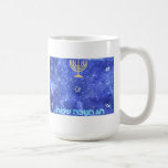 Hanukkah Snowstorm Menorah Coffee Mug<br><div class="desc">A glowing gold Hanukkah menorah and  "Chag Chanukkah Sameach" (Happy Hanukkah) in glowing blue and white text superimposed on a blue and white fractal image reminiscent of snowflakes in a storm.</div>