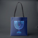 Hanukkiah Happy Hanukkah Jewish Holiday Menorah Tote Bag<br><div class="desc">Hanukkiah Symbol. Happy Hanukkah Party Jewish Holiday Blue Menorah. Jewish Holiday Chanukkah Decoration with traditional Chanuka decorative symbol - Navy Blue color hanukkiah menorah, candlestick with candles, star of David and neon blue glowing lights illustration. Hanukkah Festival of lights Event Decoration. Jerusalem, Israel. Accessories > Bags & Wallets > Totes...</div>