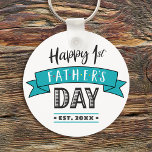 Happy 1st Father’s Day Turquoise Banner Cool Bold Keychain<br><div class="desc">“Happy First Father’s Day.” Let Dad express his joy of becoming a new parent. Cool, graphic, modern black, gray, and white typography and a teal blue banner overlay a white background Customize with the year he became a Dad for the perfect, personalized keepsake keychain he’ll use every day. This keychain...</div>