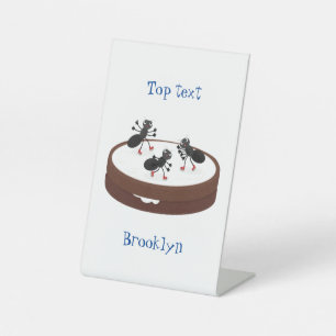 Happy ants ice skating on cookie cartoon pedestal sign