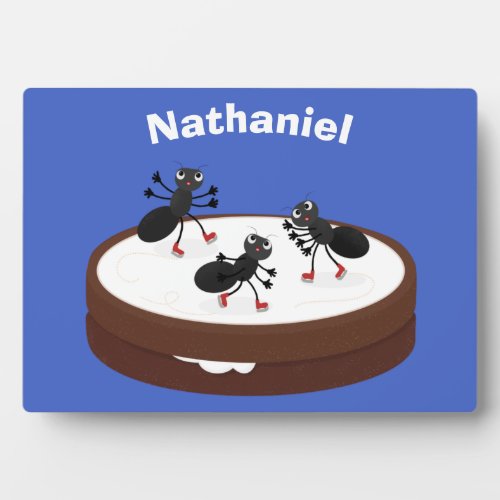 Happy ants ice skating on cookie cartoon plaque