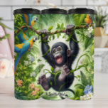 Happy Baby Gorilla Swinging in Jungle Thermal Tumbler<br><div class="desc">This cheerful illustration features a playful baby gorilla swinging and laughing from a vine in a lush jungle. Colorful parrots perch on nearby branches,  and vibrant flowers and foliage fill the scene,  creating a lively and joyful tropical environment.</div>