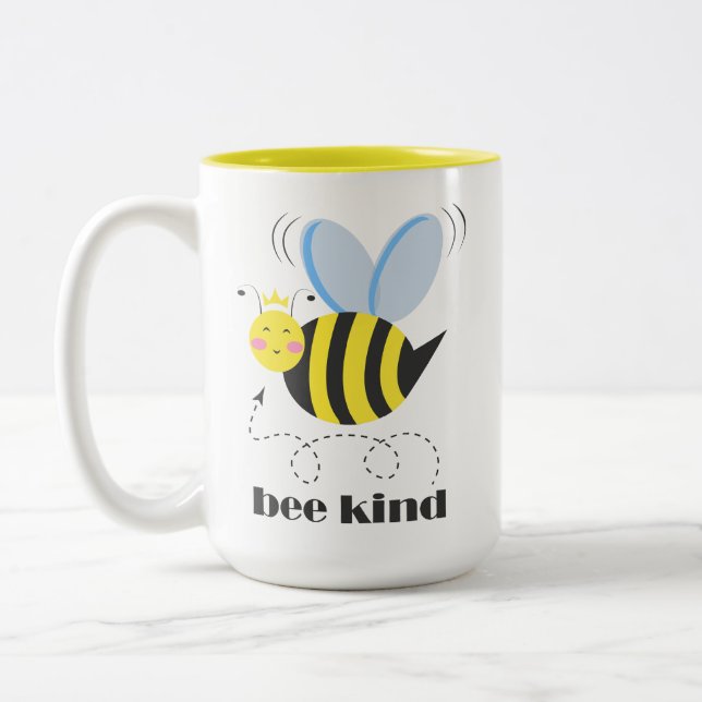 Happy bee princess with crown and slogan Bee Kind Two-Tone Coffee Mug (Left)