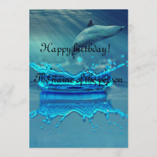 Happy birthday card with cute dolphin in the ocean