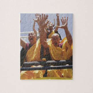 Happy buddhist monks on a roller coaster jigsaw puzzle