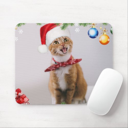 Happy cat in red christmas hat mouse pad