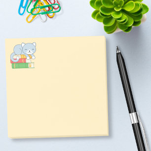 Happy Cat on top of a Book Stack Yellow Post-it Notes